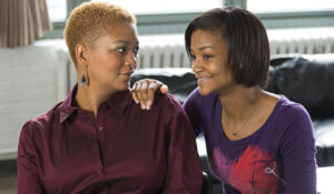 mother looking to daughter for support and daughter has hand on her shoulder